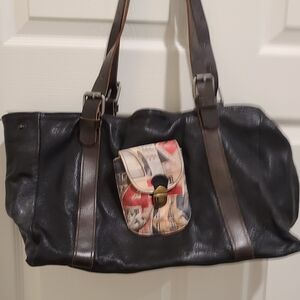 Black Leather Shoulder Bag with Brown Straps and Printed Accent